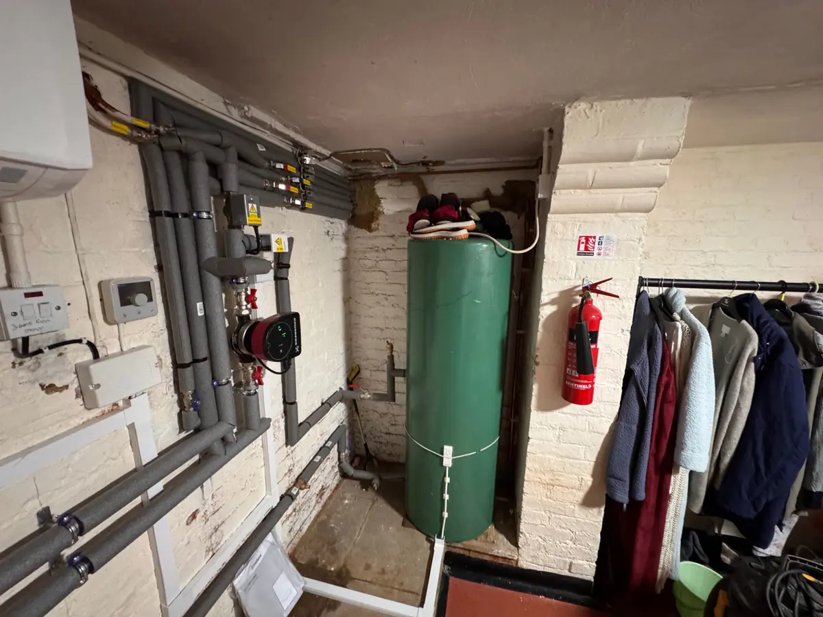Insulated heating distribution pipework and pump