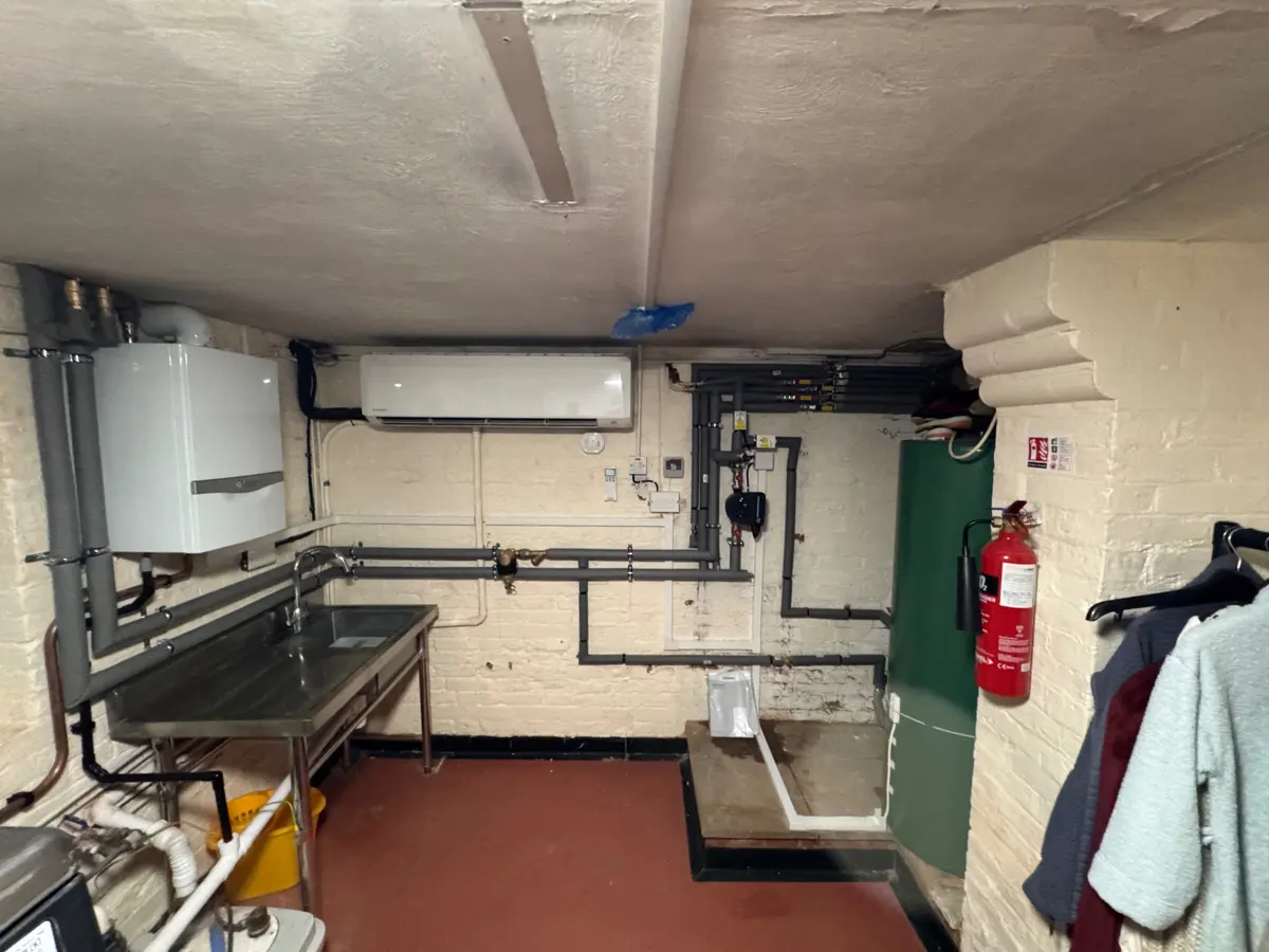 Completed boiler and heating system pipework in a plant room